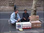 Ed playing the boxes with a 'street performer'